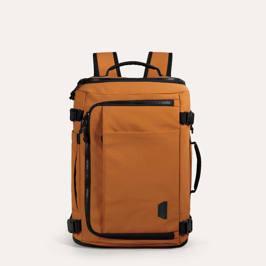 https://cdn.shopify.com/s/files/1/1990/3257/files/Blast_Quick_Access_28L-38L_Carry_On_Travel_Backpack_in_Tangerine.webp?v=1751019189